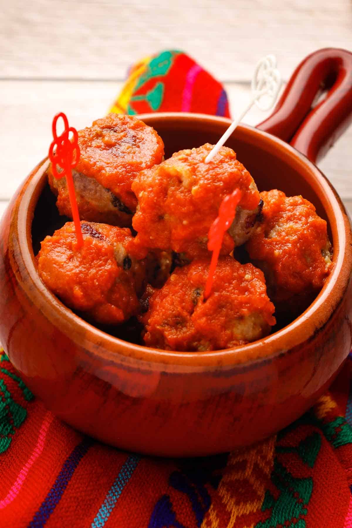 Baked meatballs in a bowl.