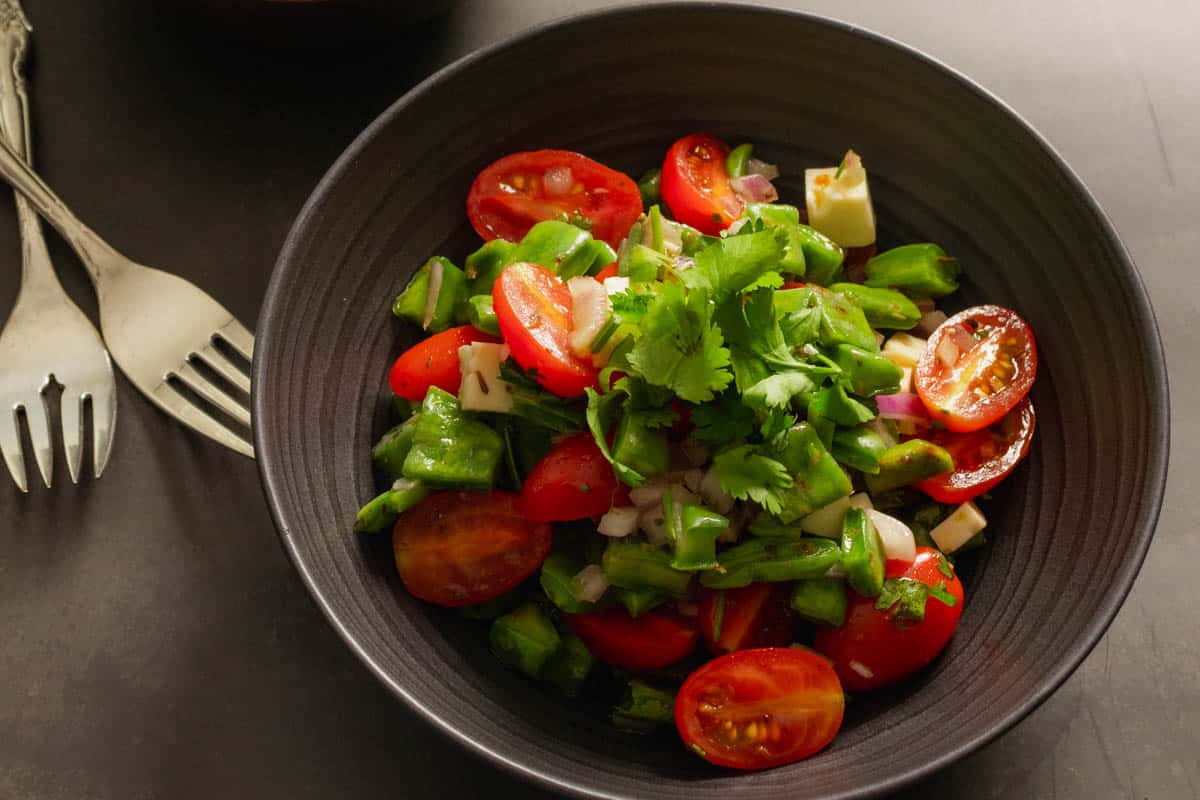 Nopales (cactus paddle) salad recipe, no heat cooking placed in a dark bowl