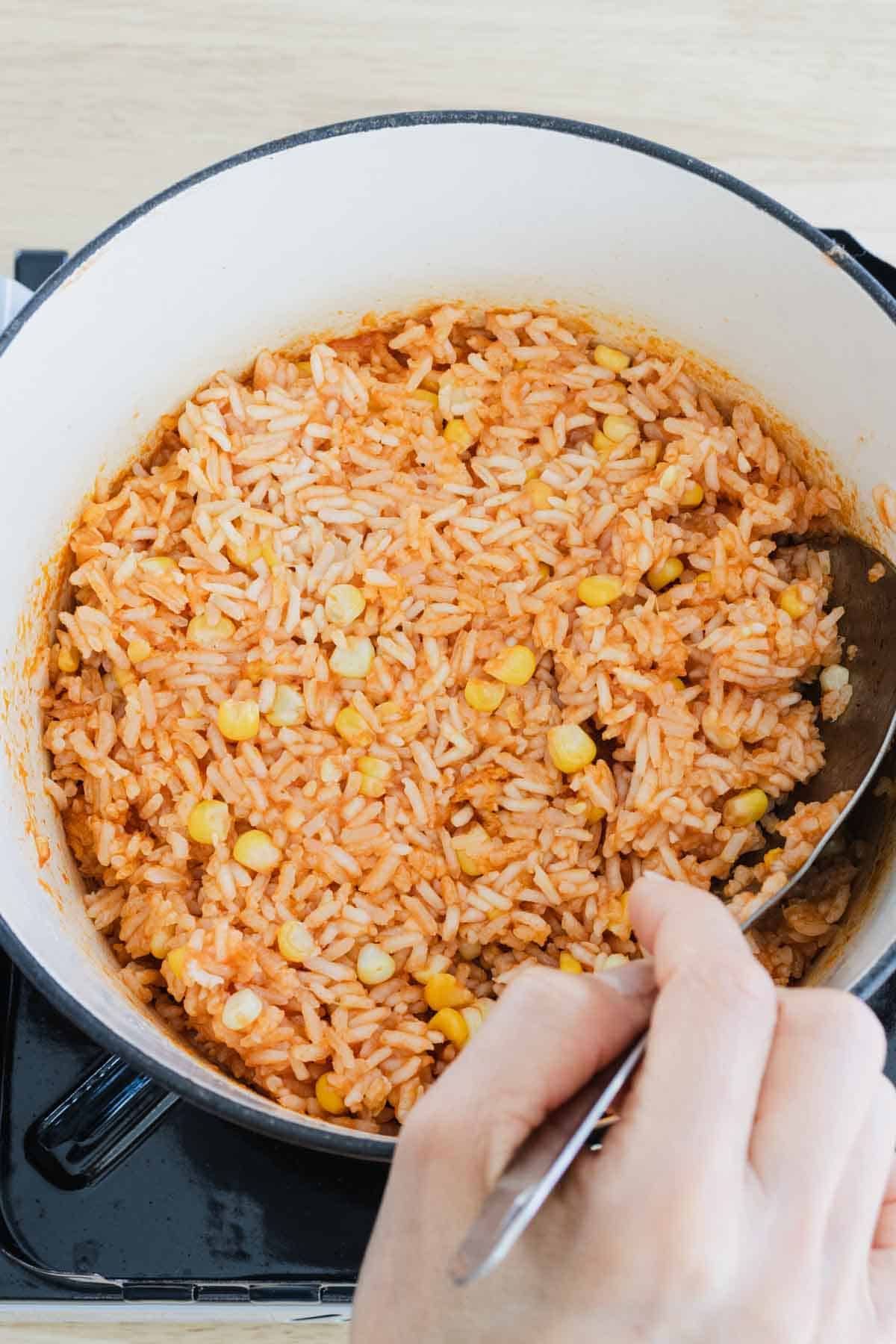 Stirring rice after resting time.