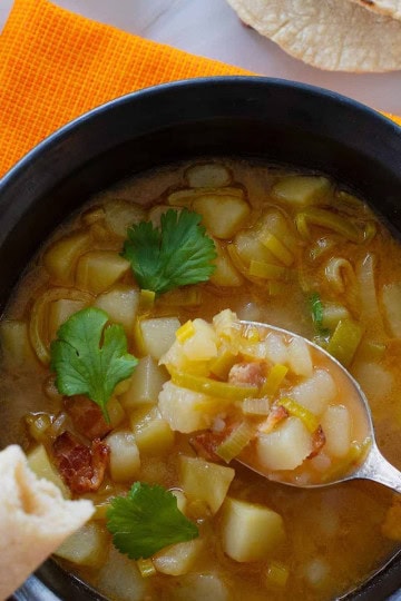 Potato and Leek soup served in a brown bowl