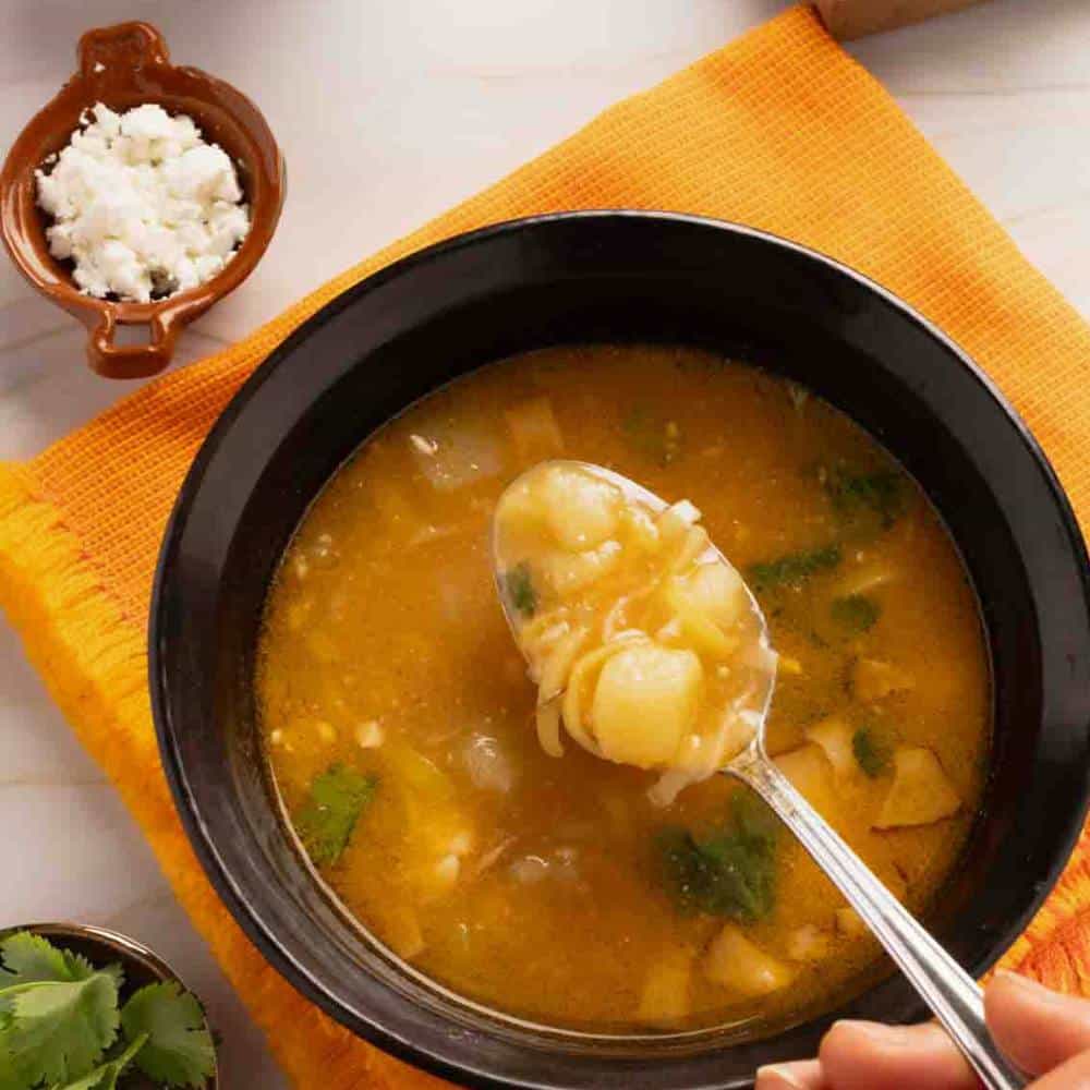 Potato and Leek Soup served in a dark brown bowl