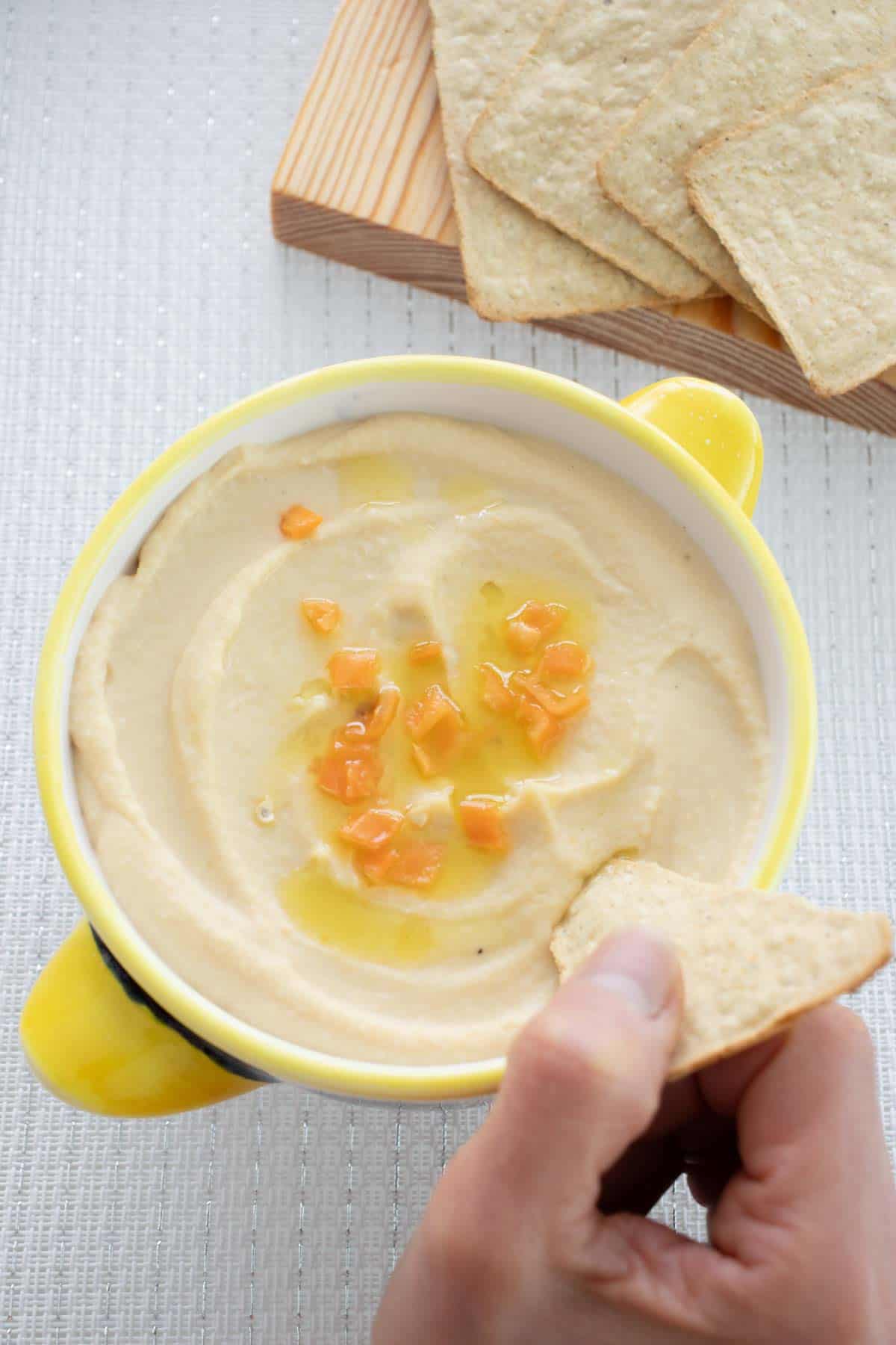 Spicy Hummus with Habanero - final presentation, dipping in with tortilla chips