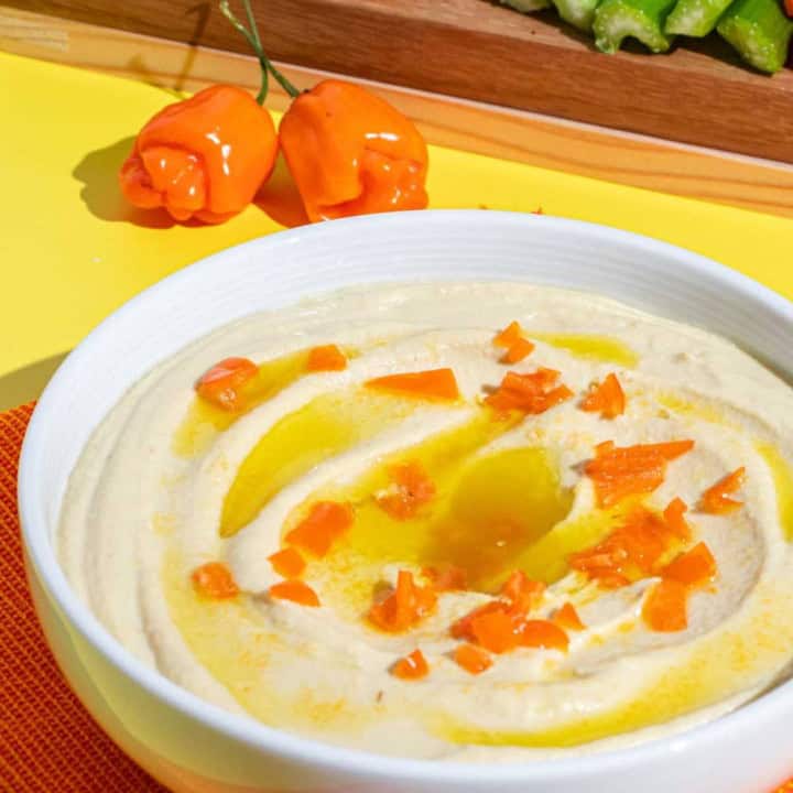 Spicy Hummus with Habanero served with pita bread, celery sticks and baby carrots.