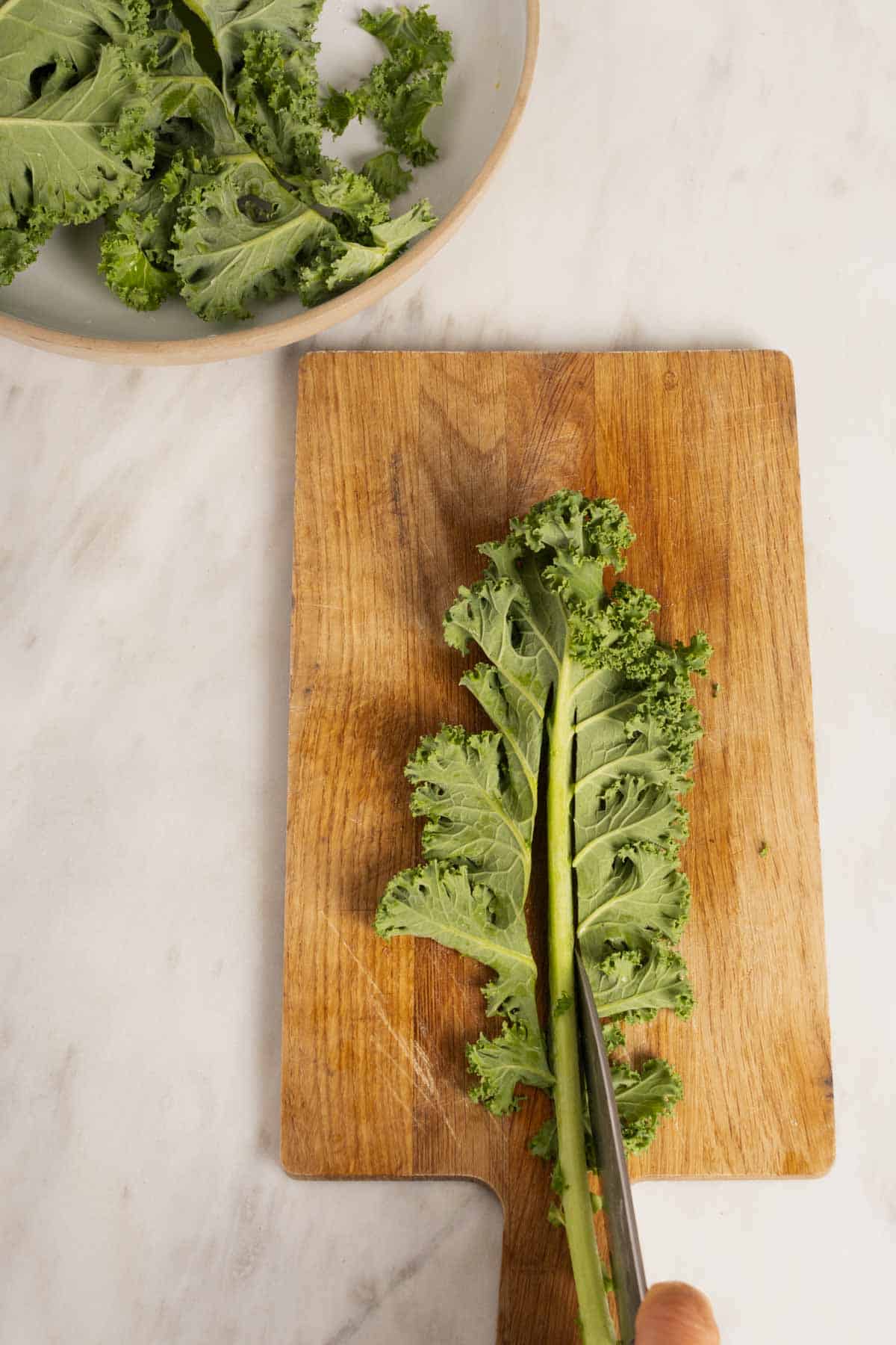 Cutting kale for lentil and kale salad.
