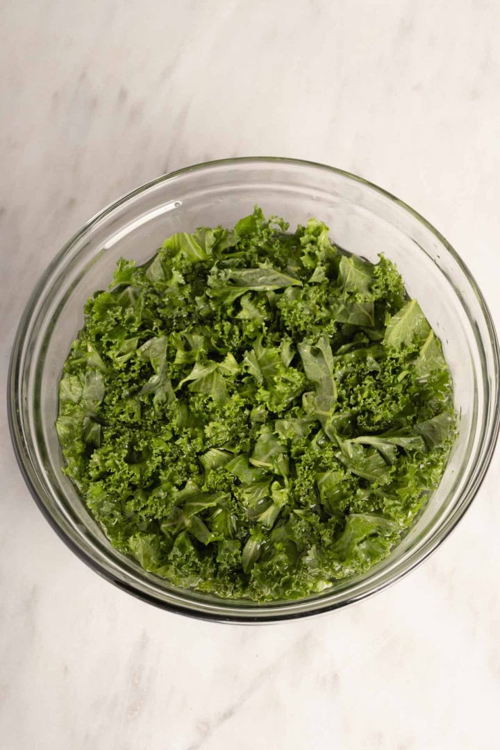 Kale sitting in warm water and then spinner dry.