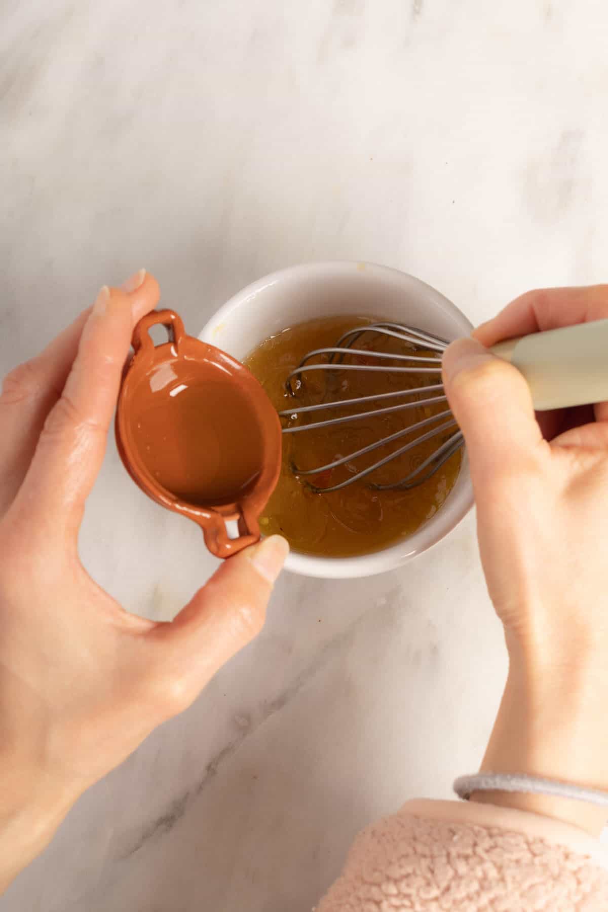 Making the vinagrette for lentil and kale salad.