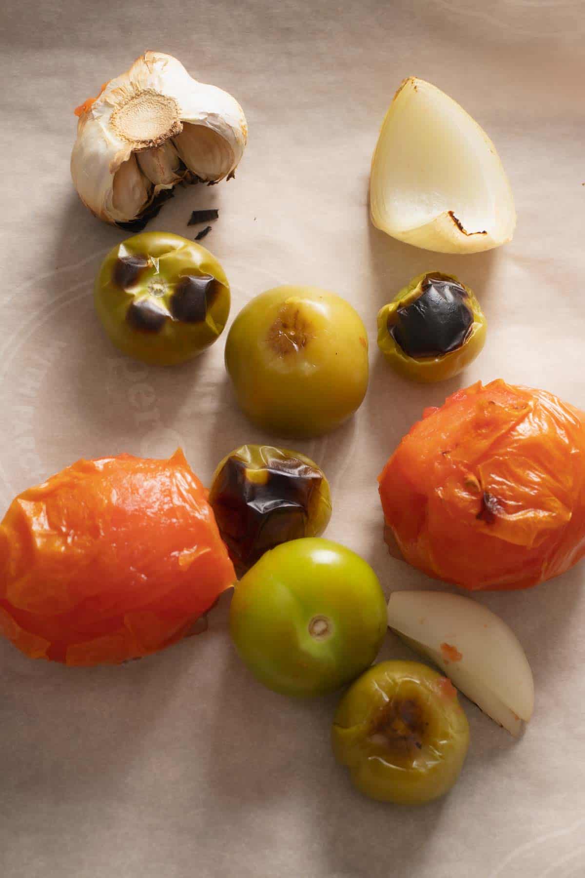 Toasting the onion, garlic, tomatillos and tomatoes for the Red Mole sauce.