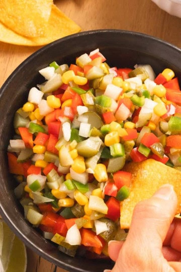 Pickle de Gallo served in a bowl with some tortilla chips on the side.