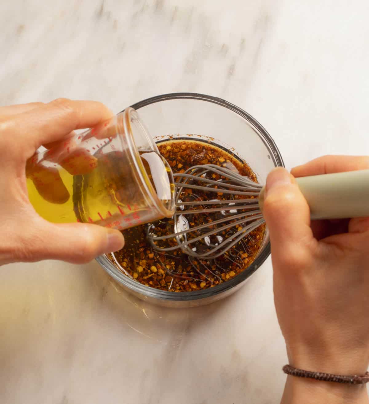 Preparing the vinaigrette for the salad with grilled peaches and balsamic vinaigrette.
