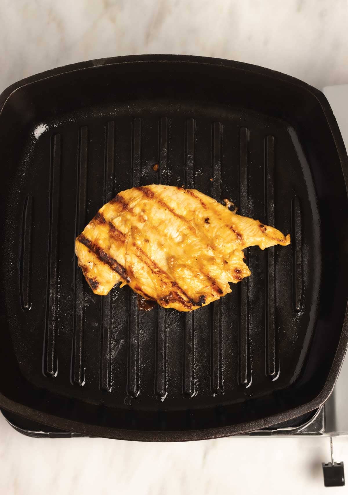 Grilling Marinated Chicken in Grill Pan.