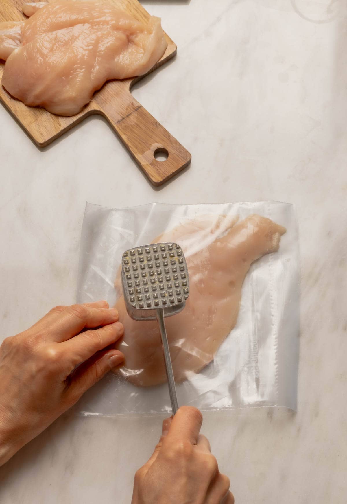 Getting the Chicken Prepared - pounding the chicken breast.
