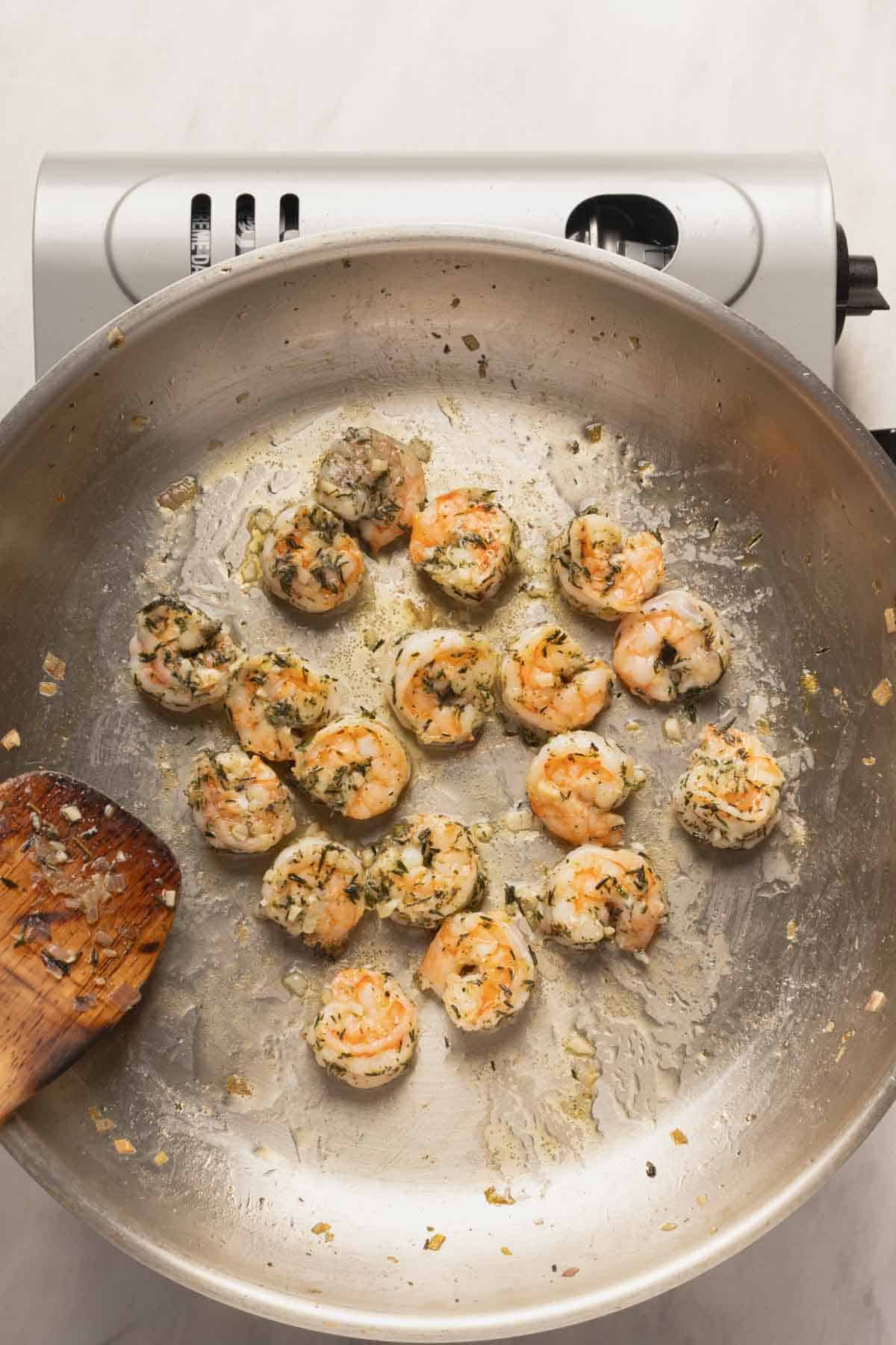 Cooking the shrimp for the pasta.