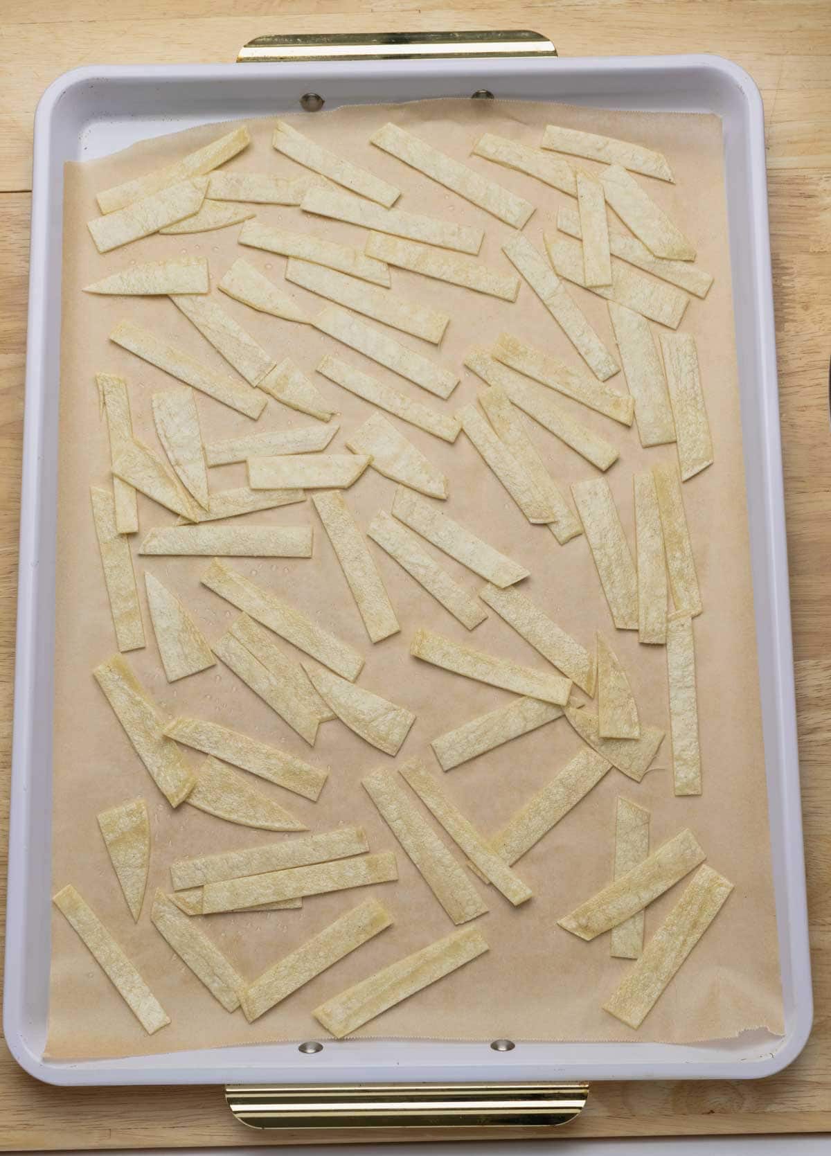 Tortilla strips in baking sheet.