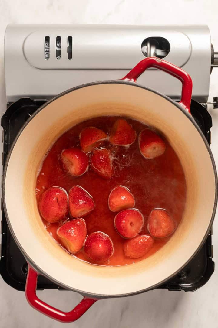 Cooking the strawberries for the Strawberry Atole (Atole de Fresa)
