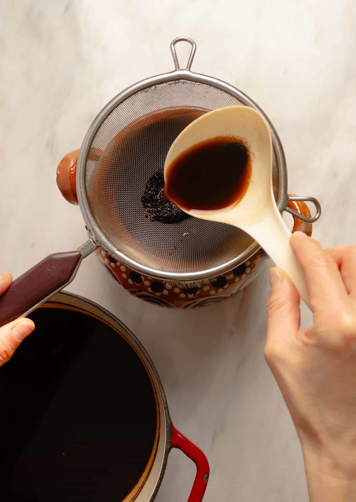 Straining the cafe de olla.